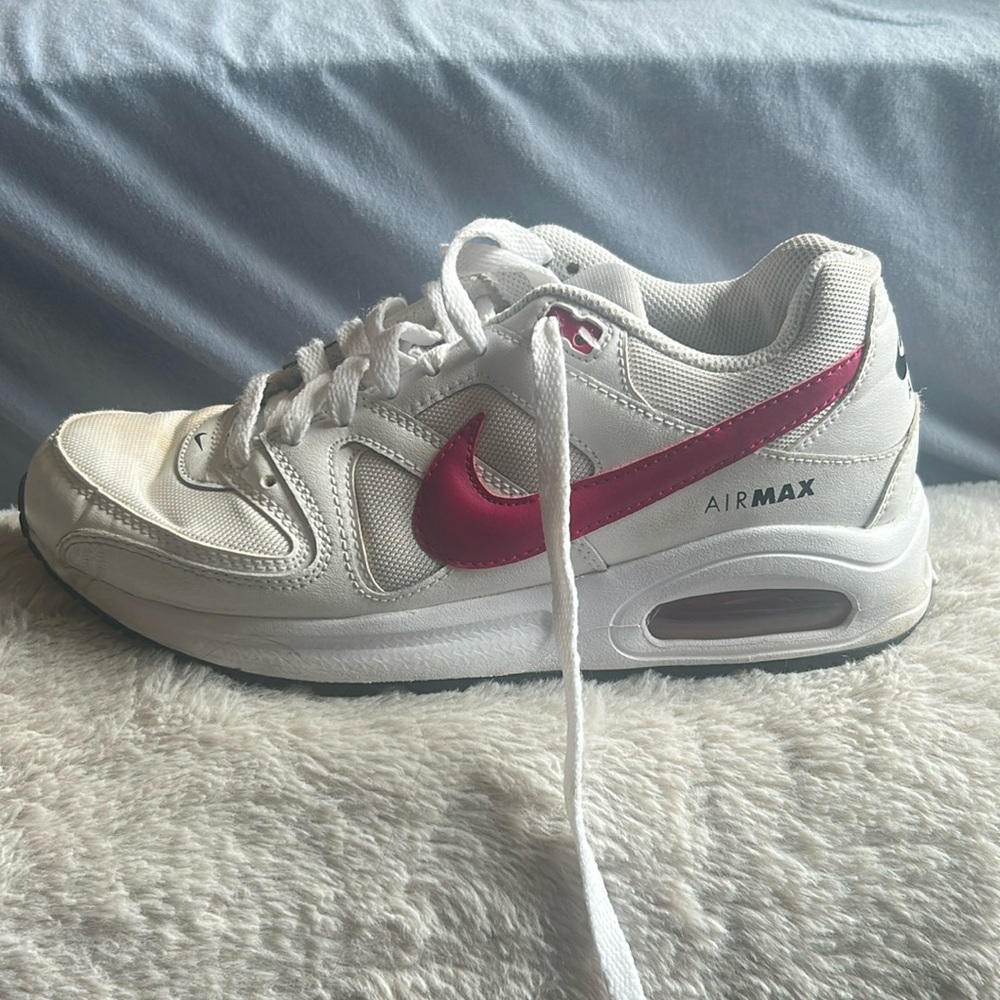 Pink and white Nike air shoes